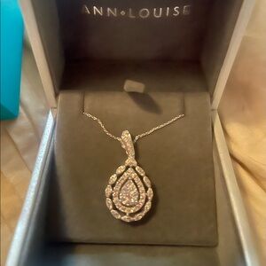 10k WHITE GOLD NECKLACE WITH GOLD/DIAMOND PENDANT.